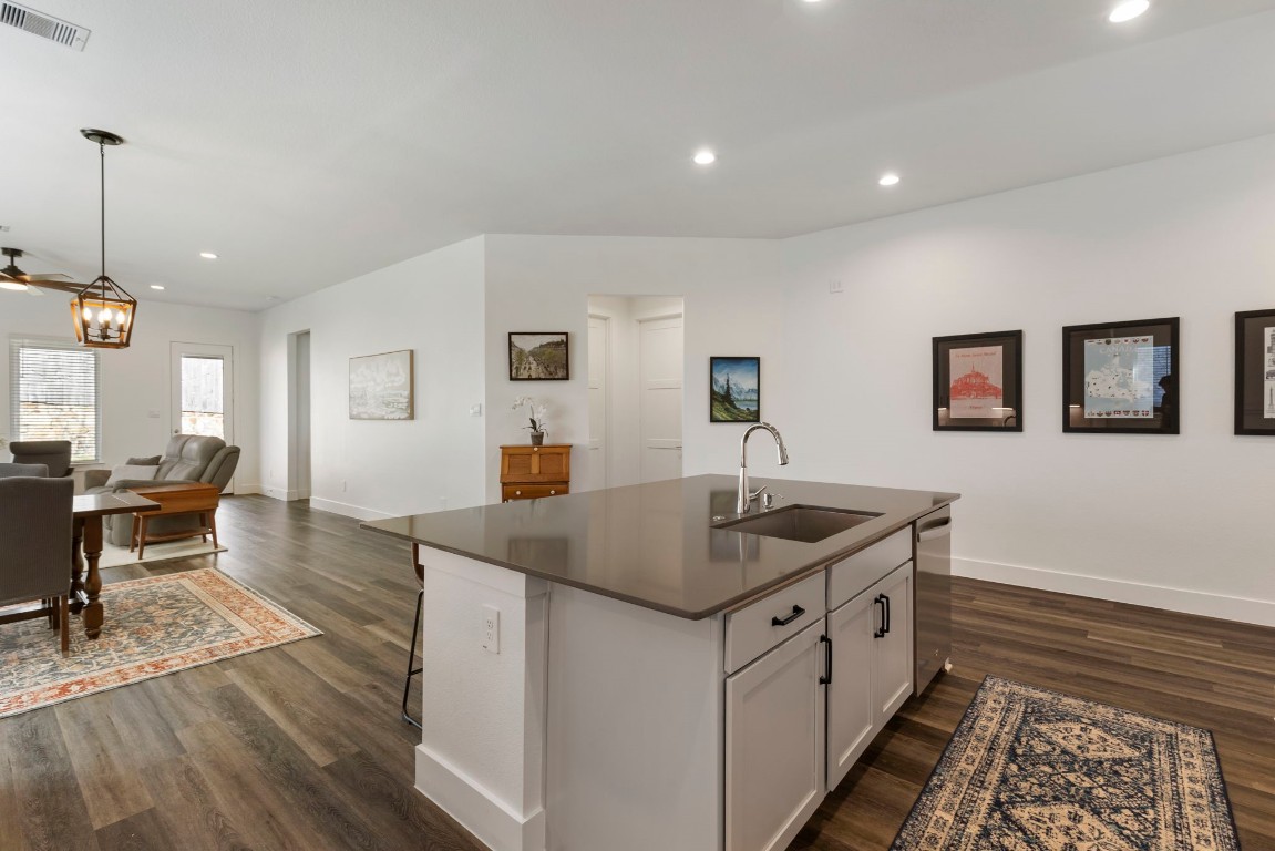 13757 Rising Sun Lane Conroe, TX 77384 - Photo 9 of 39 a open kitchen with stainless steel appliances granite countertop a sink and a refrigerator