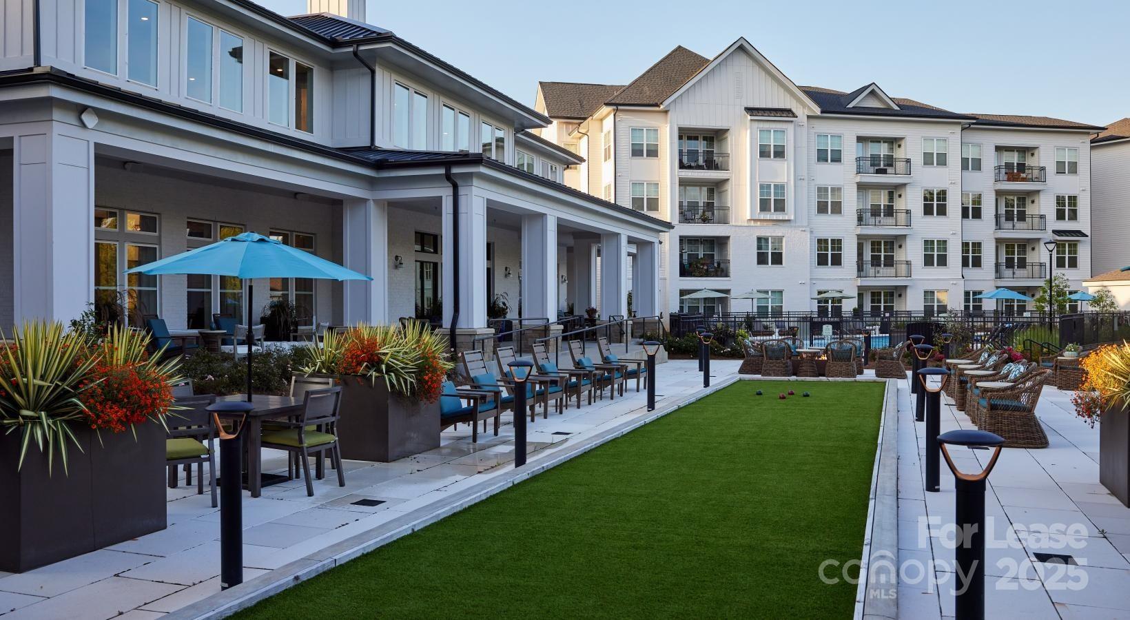 4101 Glenloch Circle, Unit A2 Matthews, NC 28105 - Photo 15 of 28 a front view of a building with sitting area