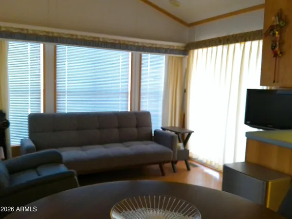 a living room with furniture and a window
