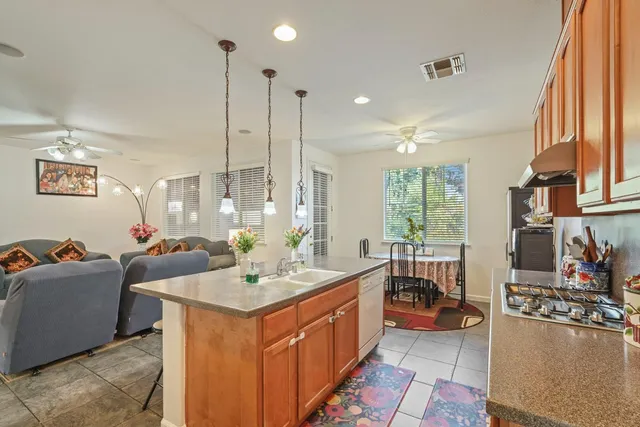 a living room with furniture a fireplace and a large window