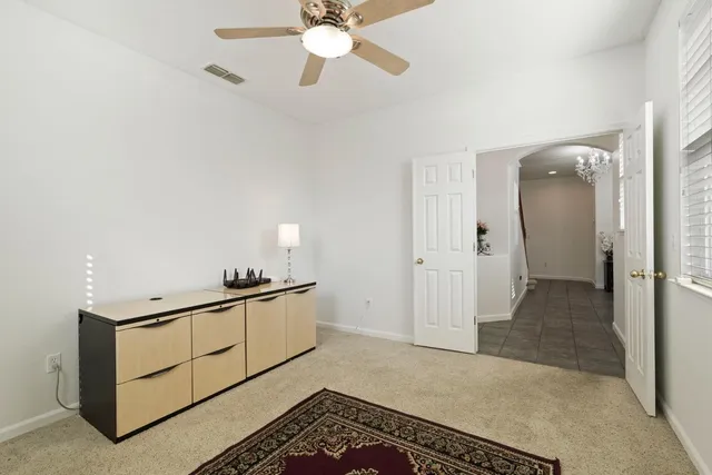 a bedroom with a large bed and a couch