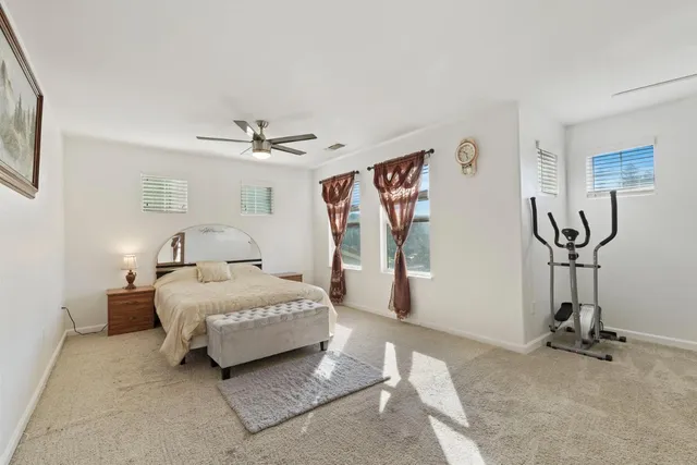 a room with furniture a chandelier and a window