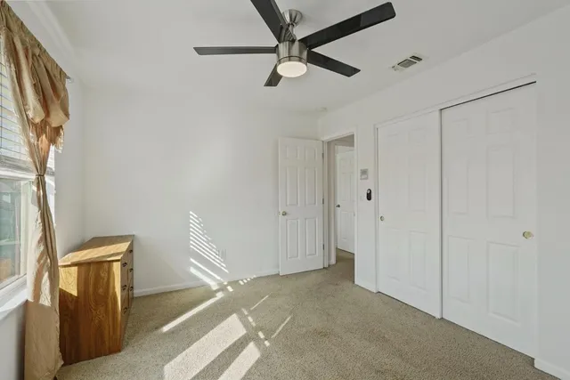 an aerial view of residential house with parking