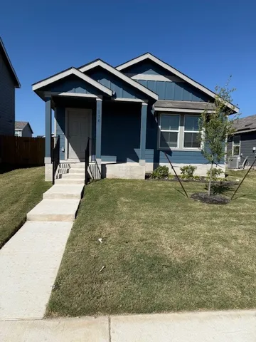a house with yard in front of it