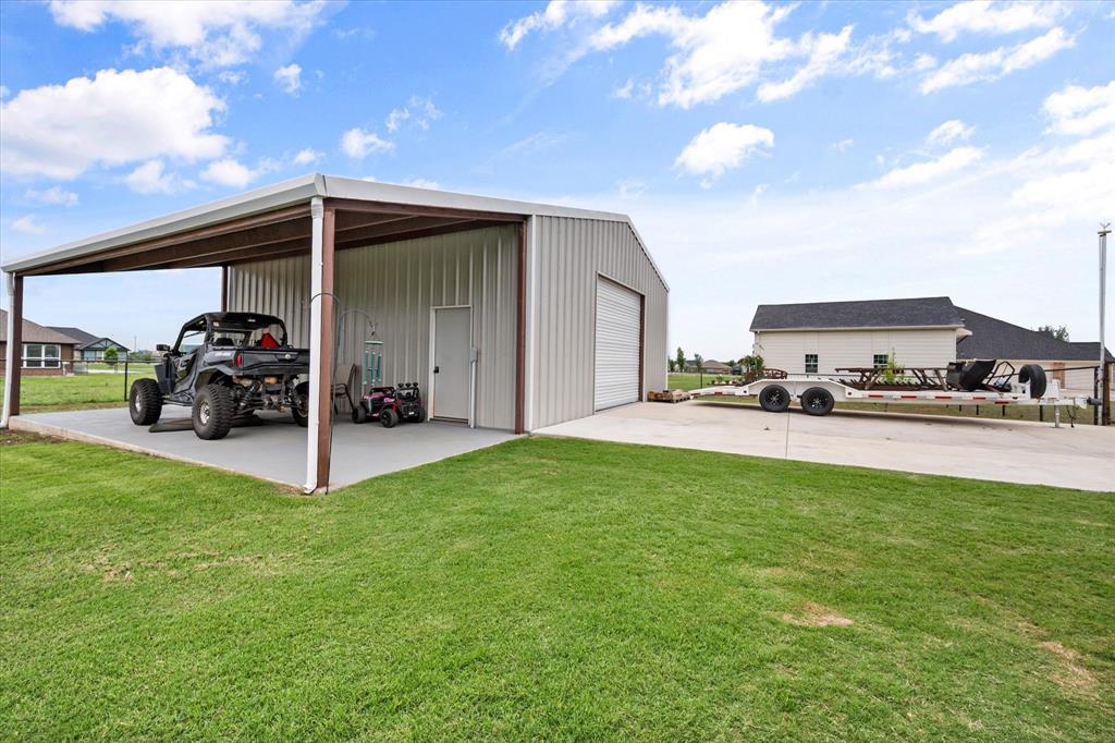 6365 Rhoden Avenue Godley, TX 76044 - Photo 27 of 31 a view of a car park in front of house