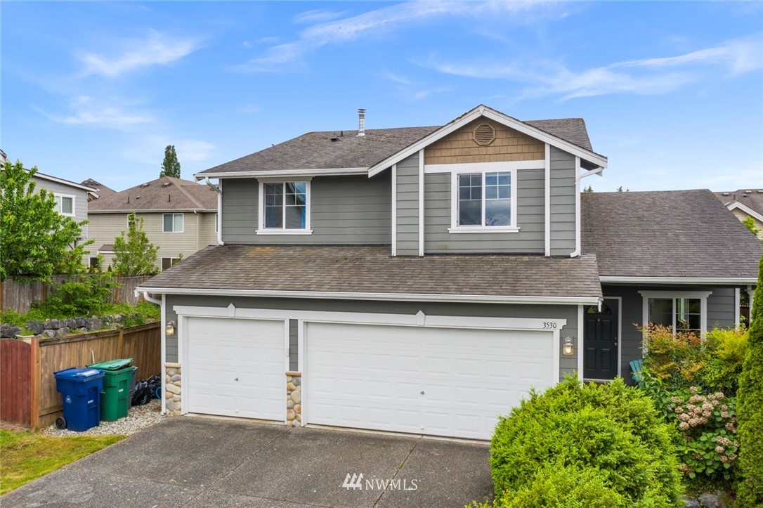 3530 186th Place Southeast Bothell, WA 98012 - Photo 1 of 38 a front view of a house with a yard