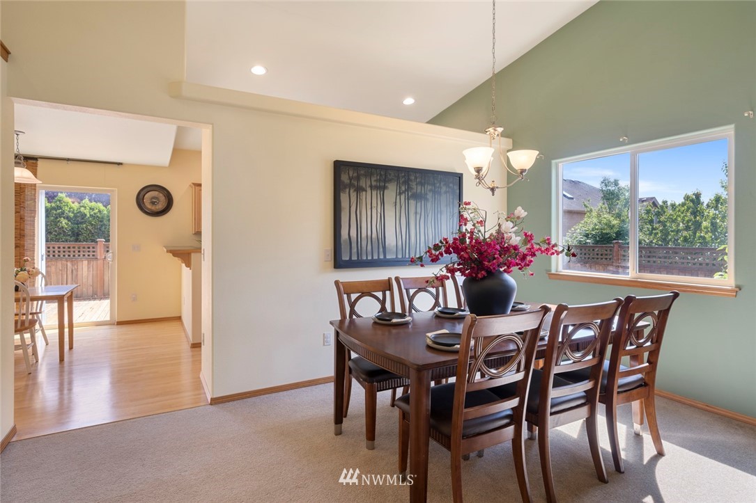 3530 186th Place Southeast Bothell, WA 98012 - Photo 13 of 38 a view of a dining room with furniture and wooden floor