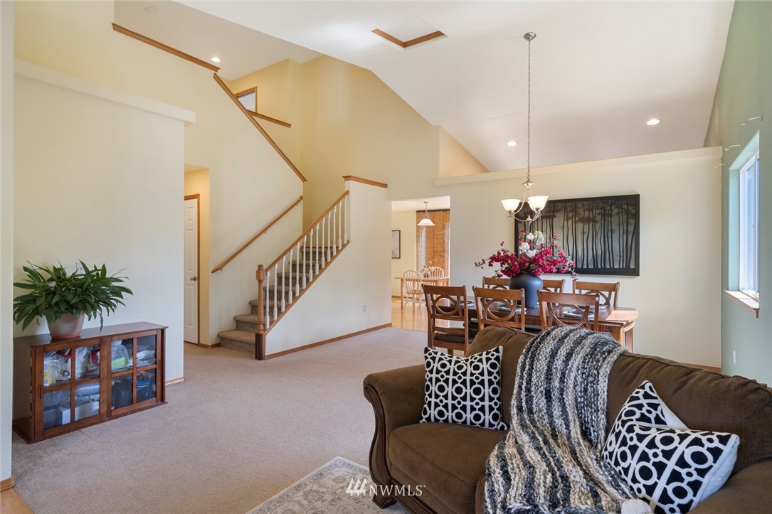 3530 186th Place Southeast Bothell, WA 98012 - Photo 16 of 38 a living room with furniture and a chandelier