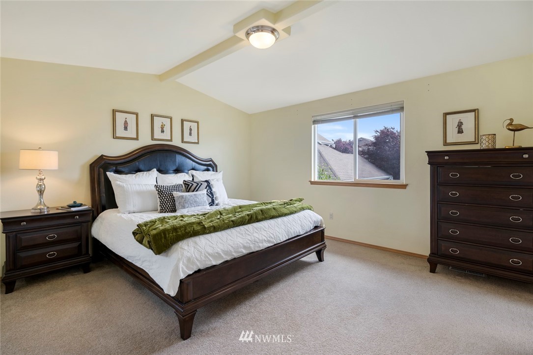 3530 186th Place Southeast Bothell, WA 98012 - Photo 18 of 38 a spacious bedroom with a bed and a dresser