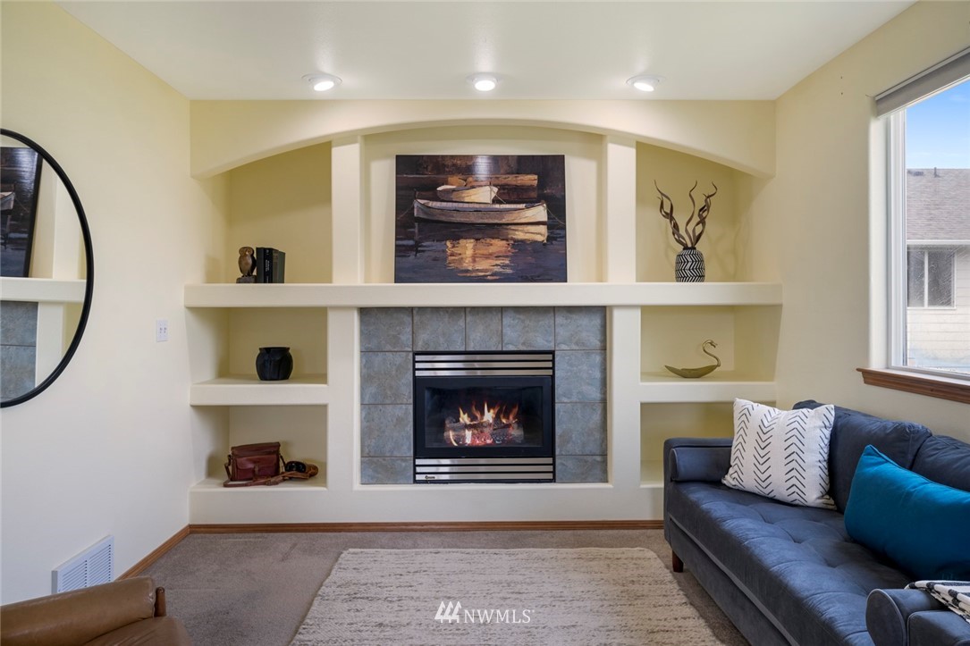 3530 186th Place Southeast Bothell, WA 98012 - Photo 22 of 38 a living room with furniture and a fireplace