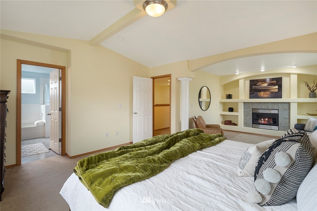 3530 186th Place Southeast Bothell, WA 98012 - Photo 23 of 38 a bed room with a bed and a fireplace