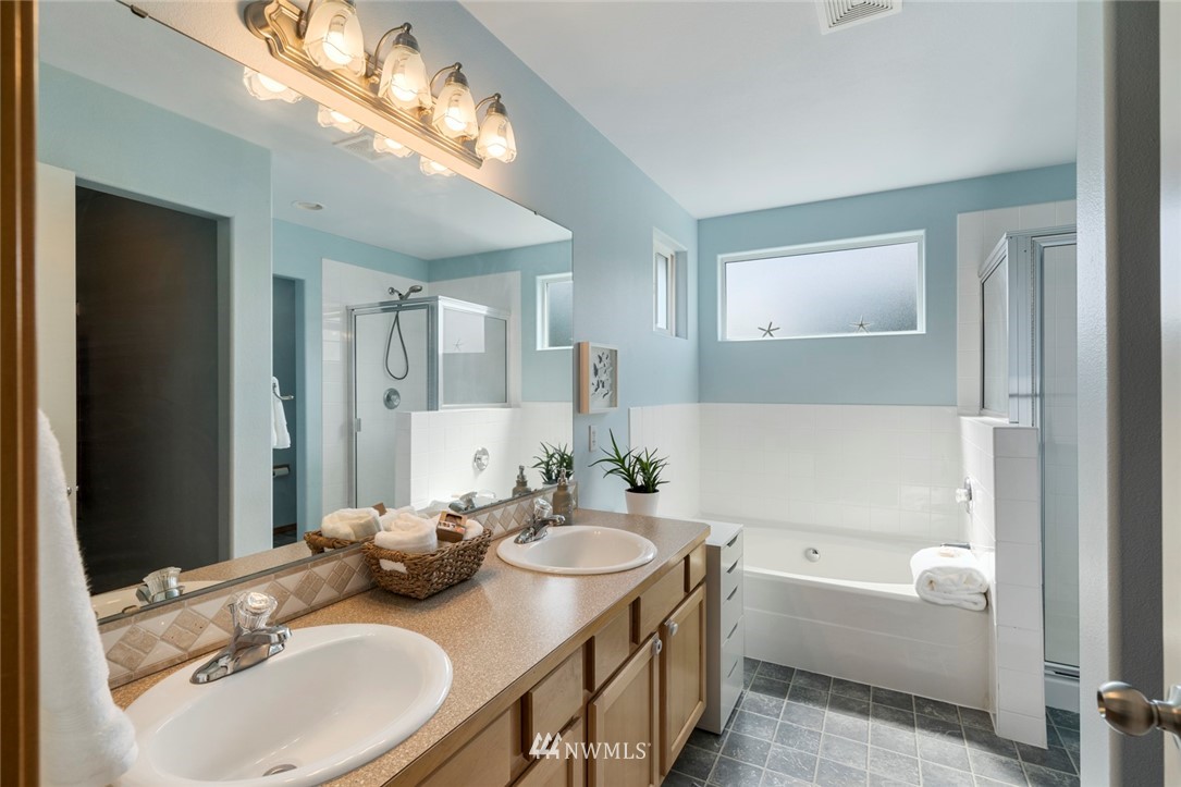 3530 186th Place Southeast Bothell, WA 98012 - Photo 24 of 38 a bathroom with a tub a sink and mirror