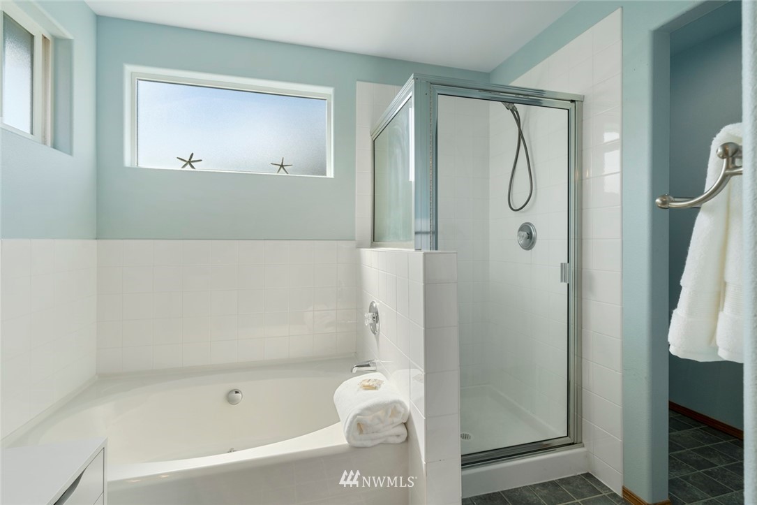 3530 186th Place Southeast Bothell, WA 98012 - Photo 26 of 38 a bathroom with a bathtub a shower and a sink