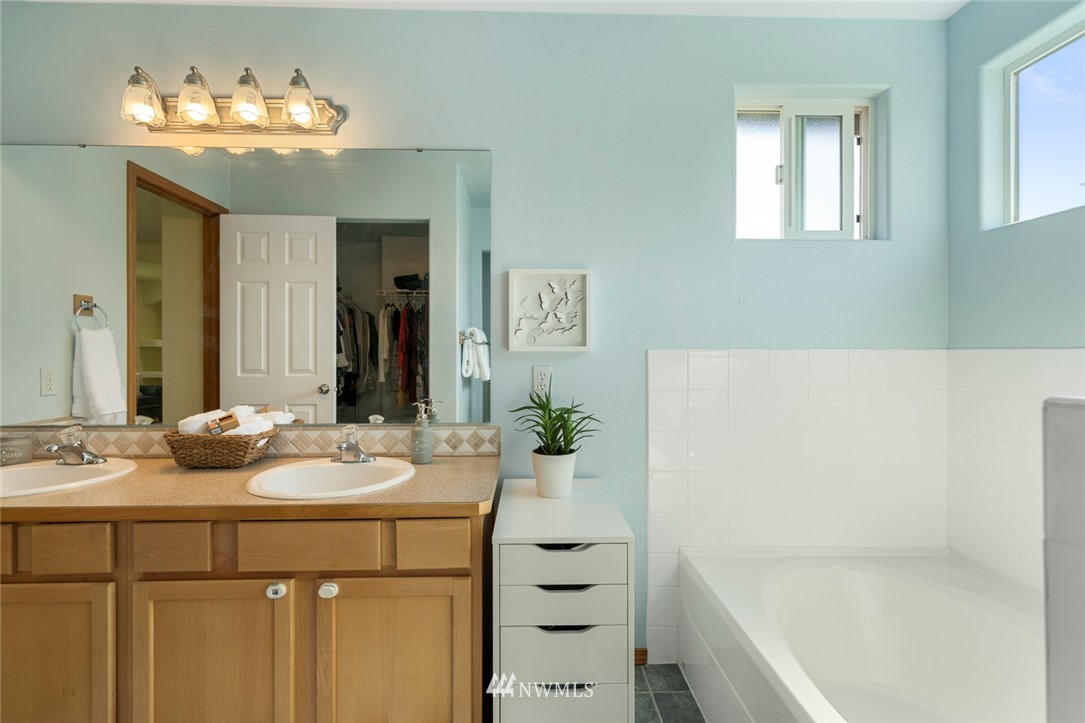 3530 186th Place Southeast Bothell, WA 98012 - Photo 27 of 38 a bathroom with a sink tub double vanity and mirror
