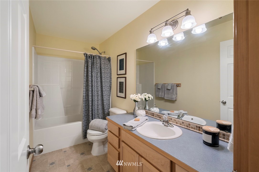 3530 186th Place Southeast Bothell, WA 98012 - Photo 29 of 38 a bathroom with a sink a toilet and shower