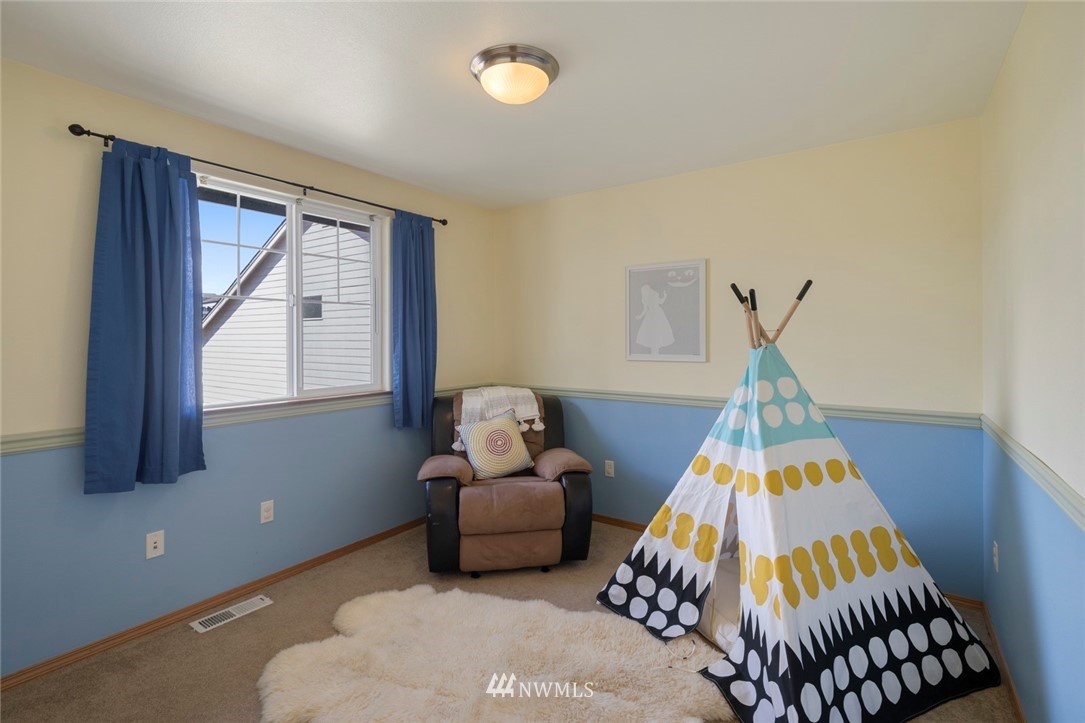 3530 186th Place Southeast Bothell, WA 98012 - Photo 30 of 38 a bedroom with bed and a window