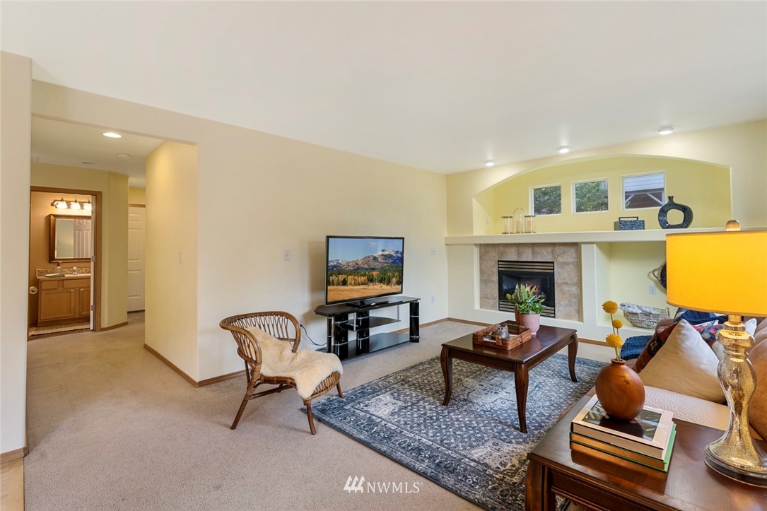 3530 186th Place Southeast Bothell, WA 98012 - Photo 4 of 38 a living room with furniture and a fireplace