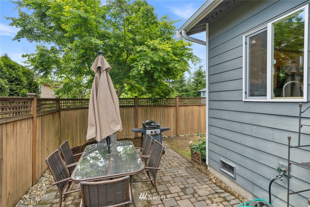 3530 186th Place Southeast Bothell, WA 98012 - Photo 34 of 38 a patio with table and chairs and potted plants