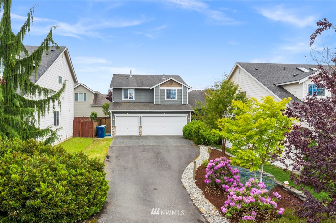 3530 186th Place Southeast Bothell, WA 98012 - Photo 36 of 38 a front view of a house with a yard and fountain