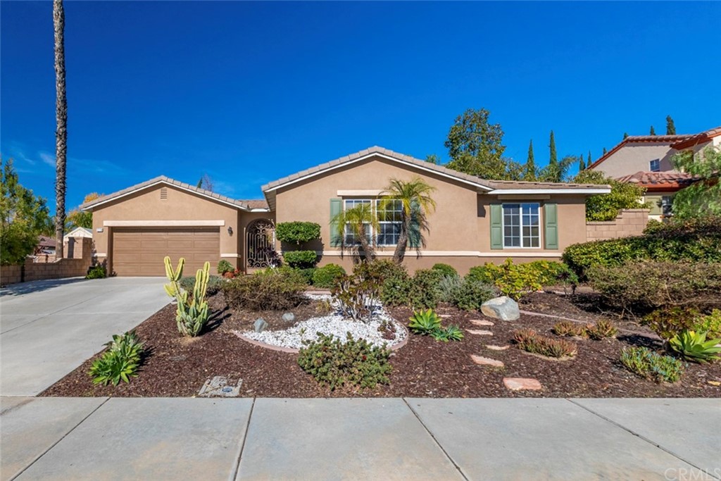 12716 Avocado Way Riverside, CA 92503 - Photo 1 of 1 a front view of a house with garden