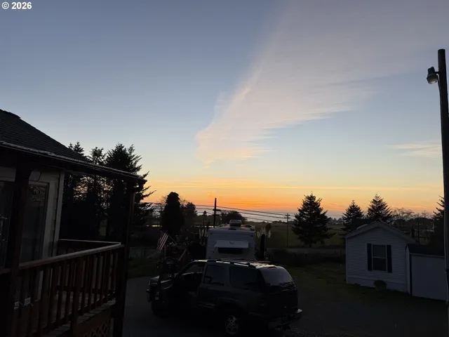 a view of balcony with furniture and city view