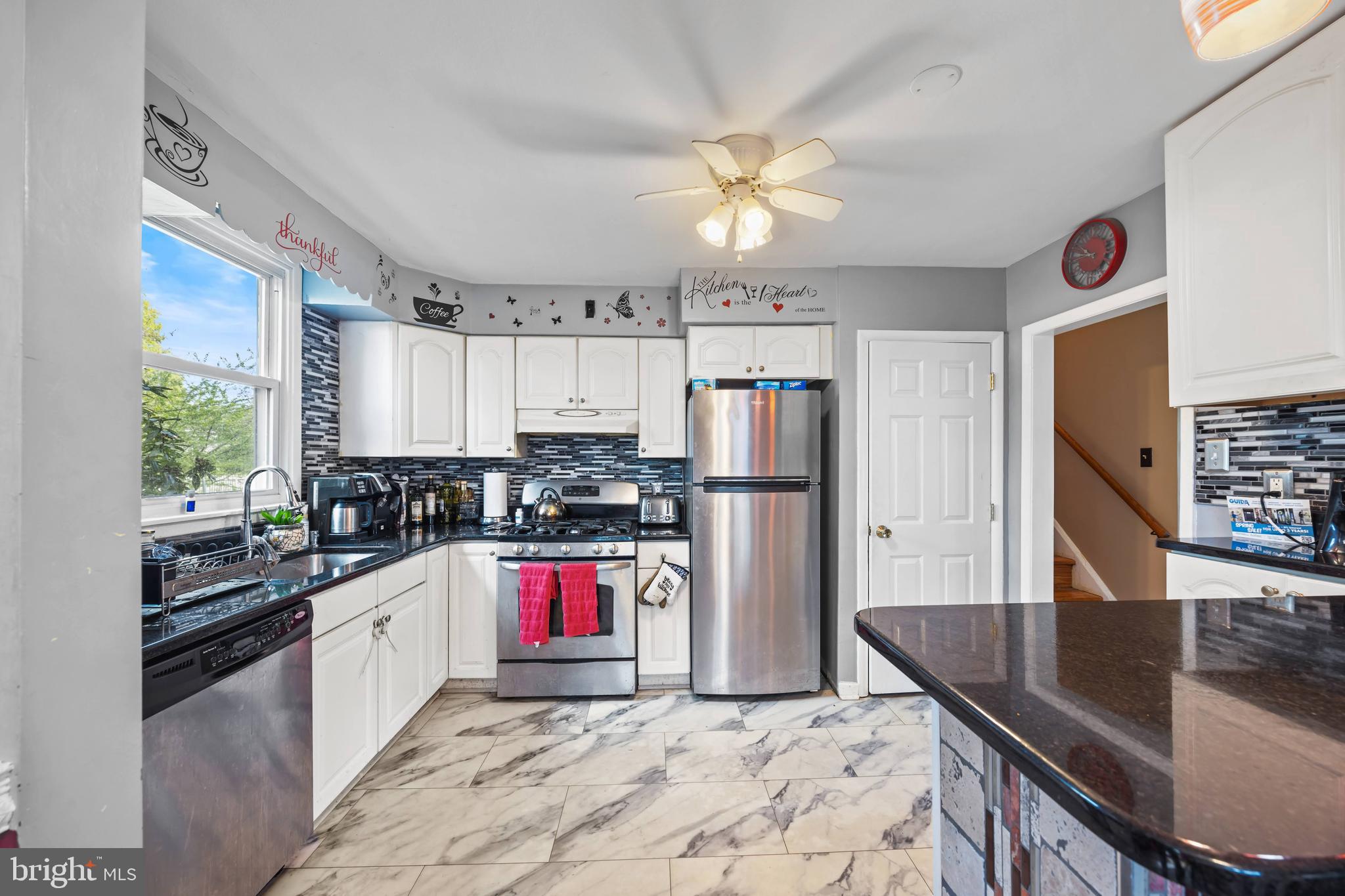 1023 Victoria Road Warminster, PA 18974 - Photo 8 of 27 a kitchen with stainless steel appliances granite countertop a sink dishwasher stove and refrigerator