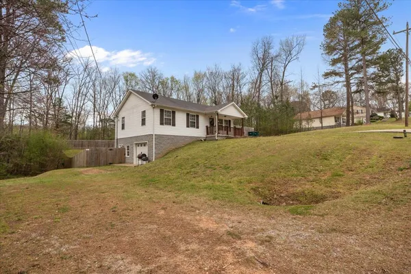 a view of a house with a yard