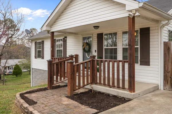 a front view of a house with a porch