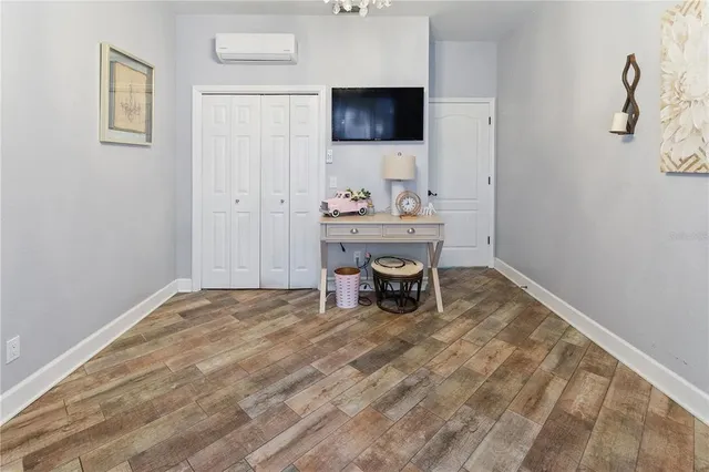 a bed room with a bed and a chandelier