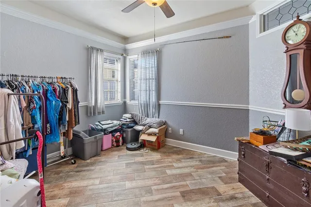 a bathroom with a granite countertop sink a toilet and shower