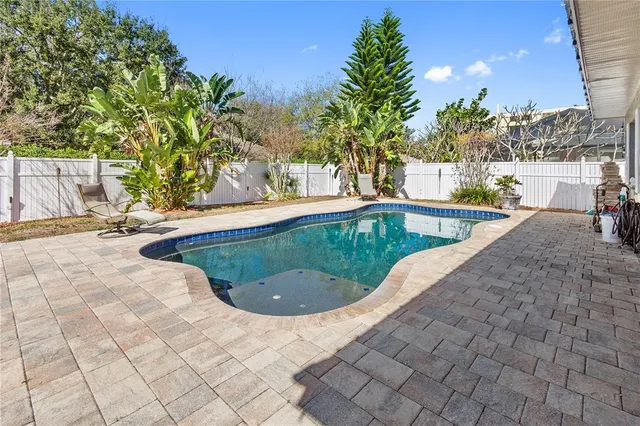 a view of a swimming pool with a patio