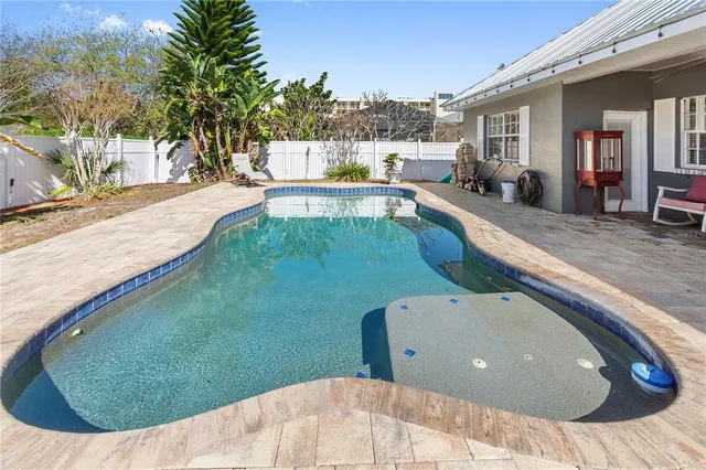 a view of a chairs and table in a patio
