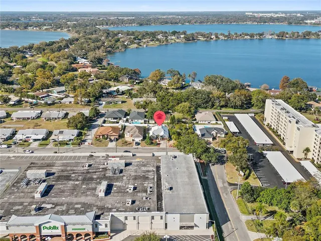 an aerial view of a house with a lake view