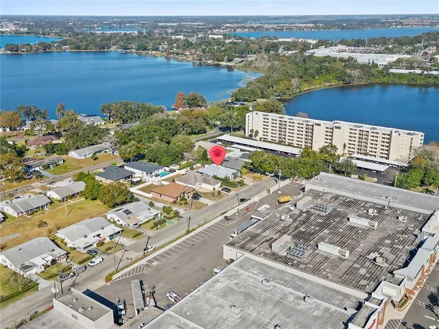 an aerial view of residential building and lake