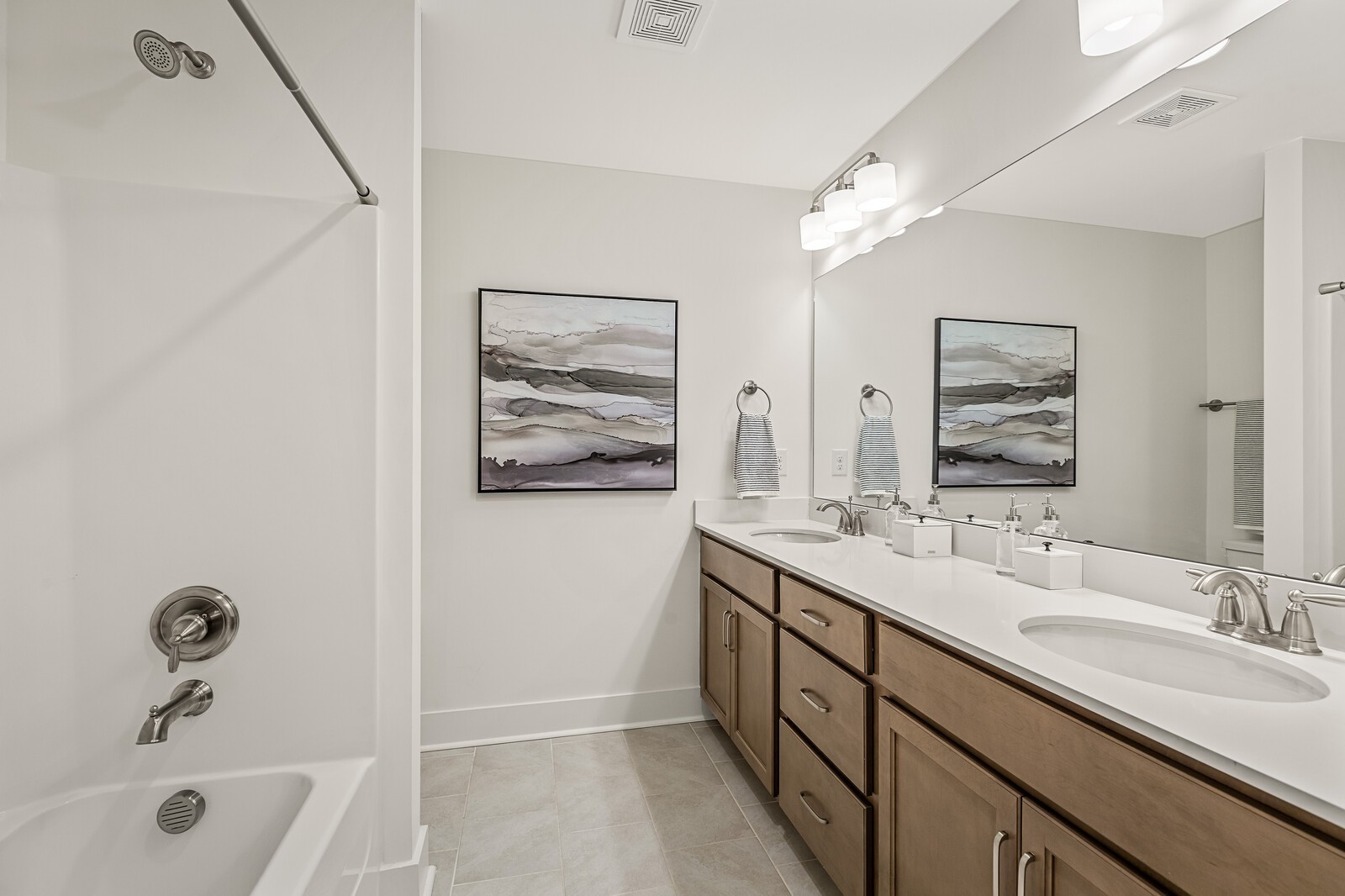 907 Heatherfield Ln Spring Hill Spring Hill, TN 37174 - Photo 18 of 19 a bathroom with a tub a sink and mirror
