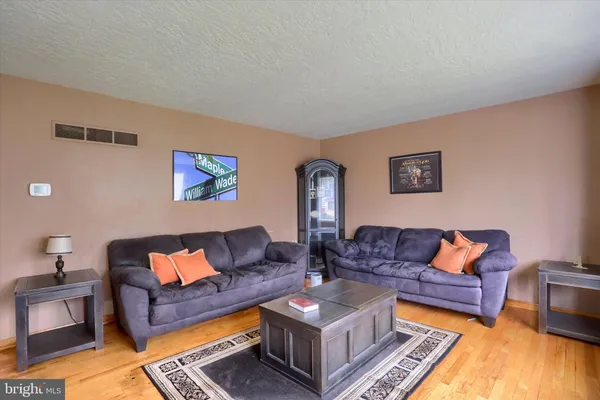 a living room with furniture and a couch