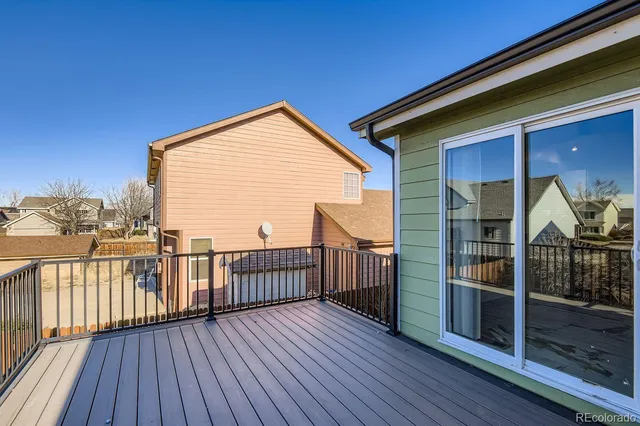 a view of balcony with wooden floor