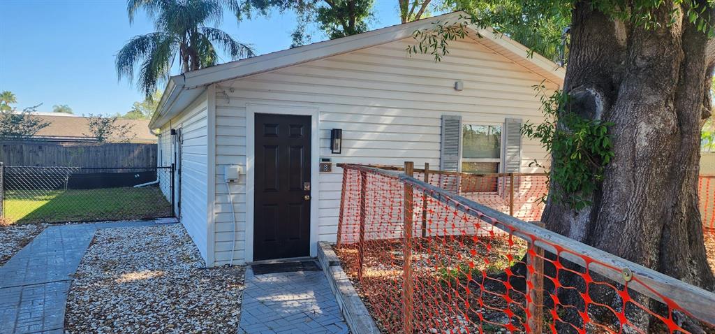 15509 Casey Rd Extension, Unit A Tampa, FL 33624 - Photo 1 of 13 a view of a house with wooden fence