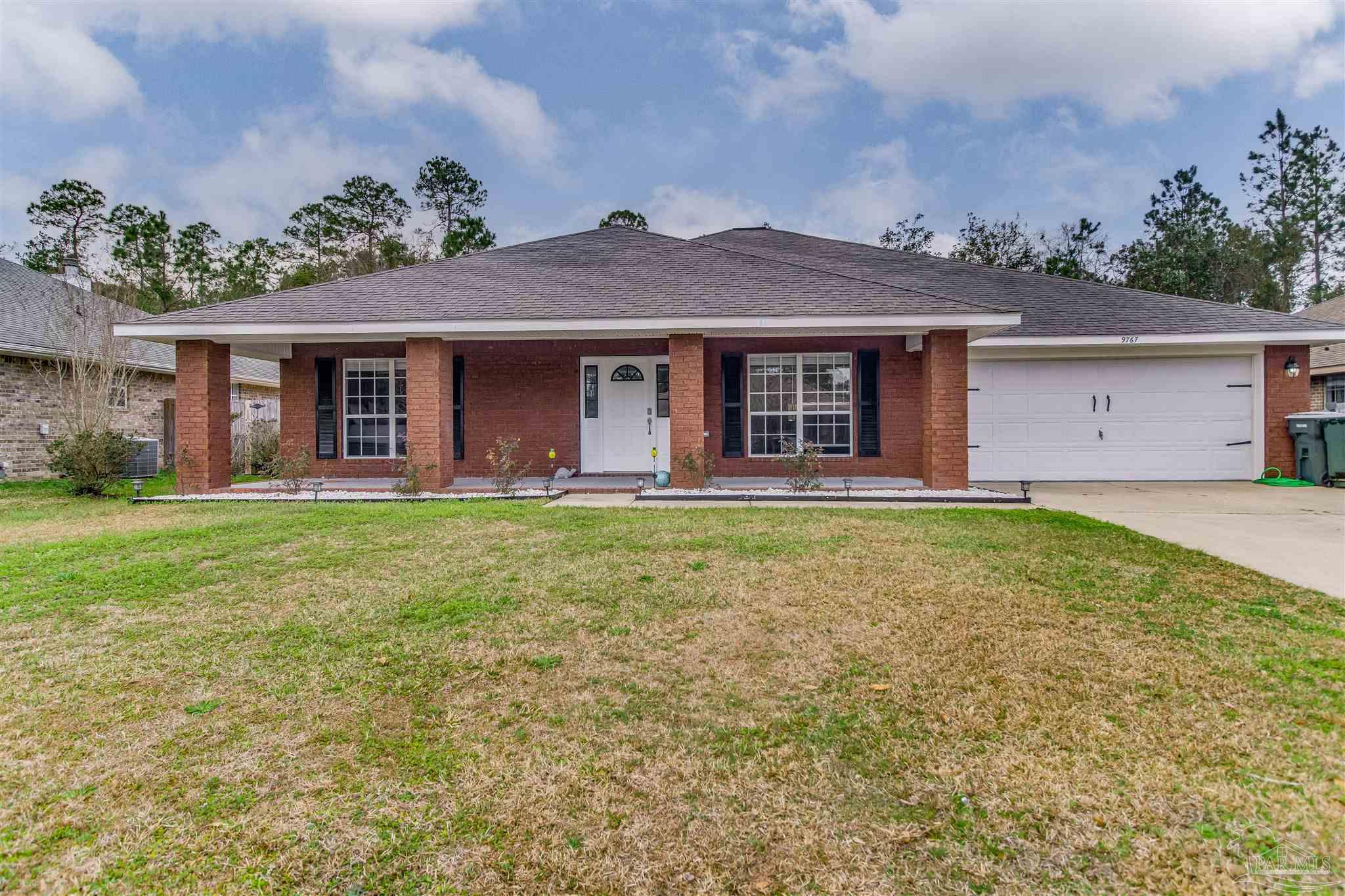 front view of a house with a yard