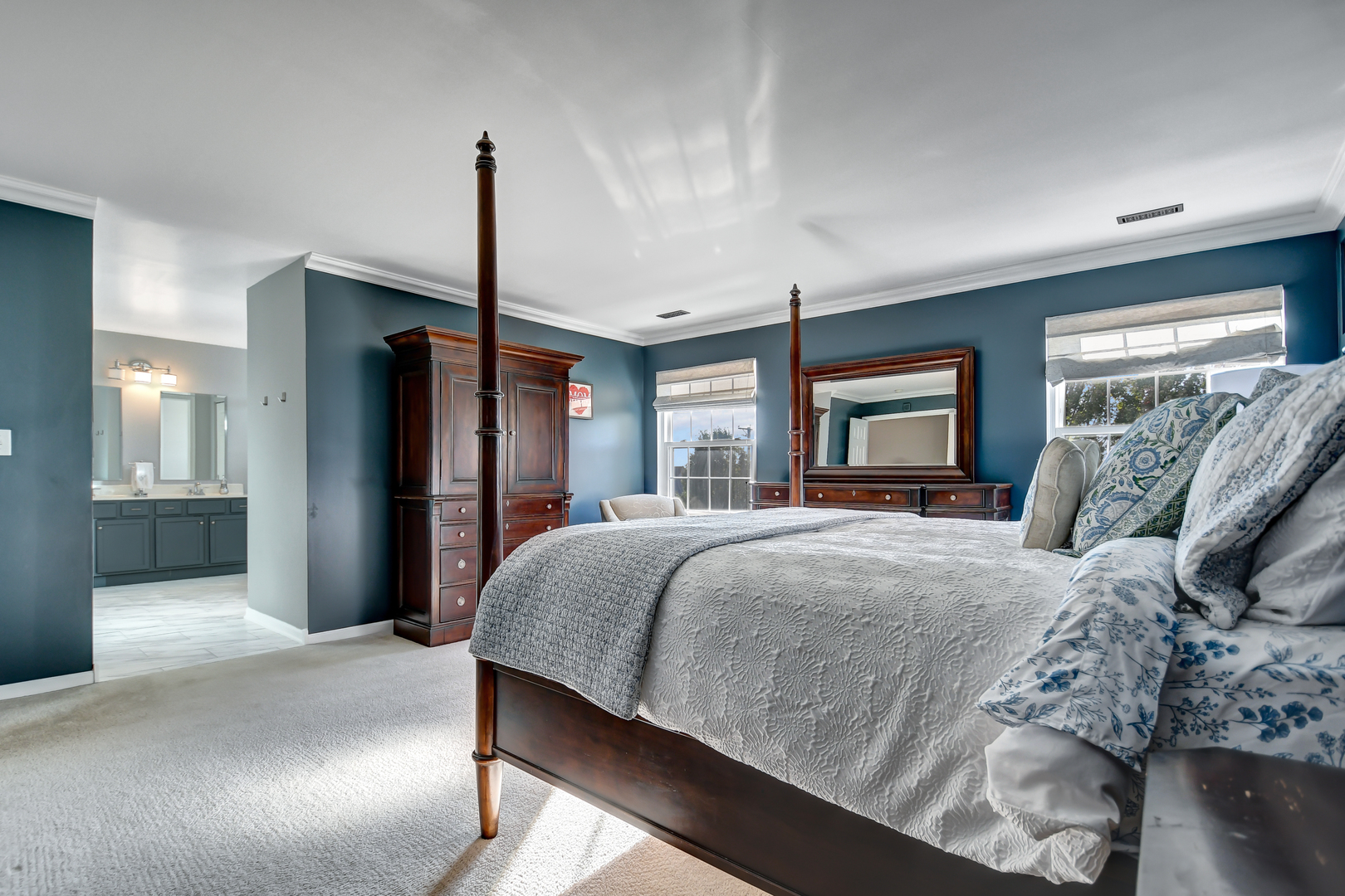 25758 South Basswood Road Channahon, IL 60410 - Photo 22 of 42 a bedroom with a bed ceiling fan and a window