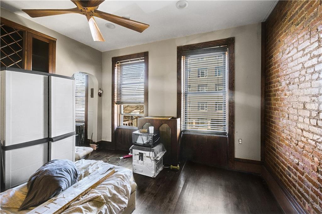 1030 Greene Avenue Brooklyn, NY 11221 - Photo 16 of 19 a bedroom with furniture and a window