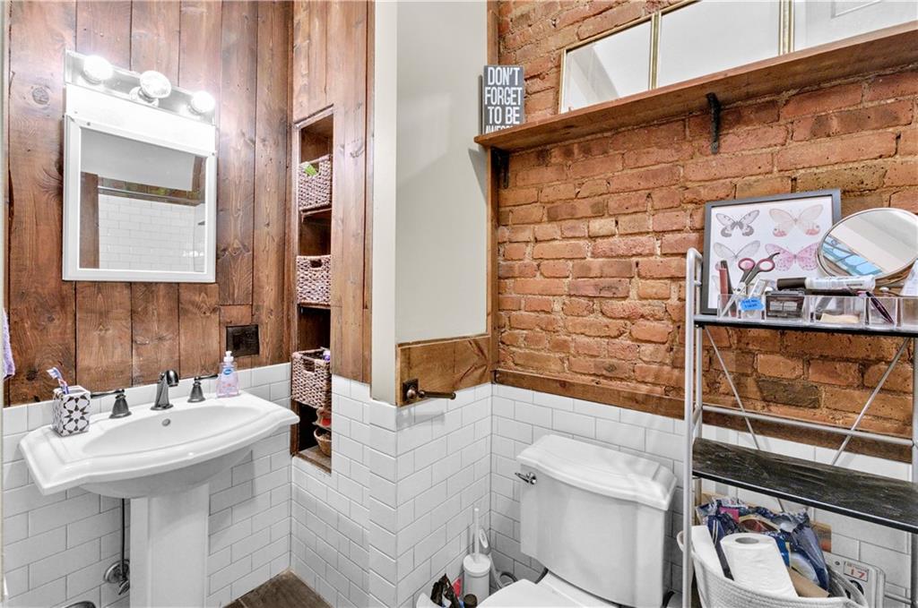 1030 Greene Avenue Brooklyn, NY 11221 - Photo 5 of 19 a bathroom with a sink and a mirror