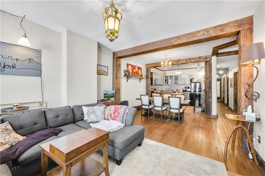 1030 Greene Avenue Brooklyn, NY 11221 - Photo 6 of 19 a living room with furniture and a large window