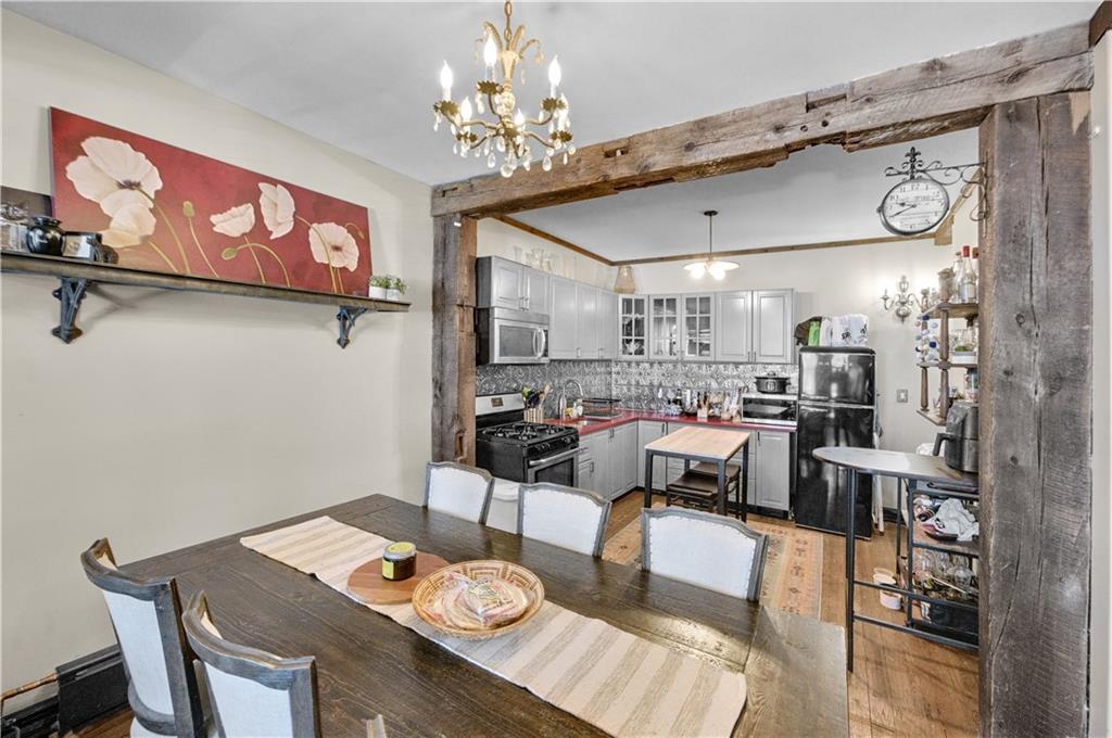 1030 Greene Avenue Brooklyn, NY 11221 - Photo 9 of 19 a view of a dining room with furniture