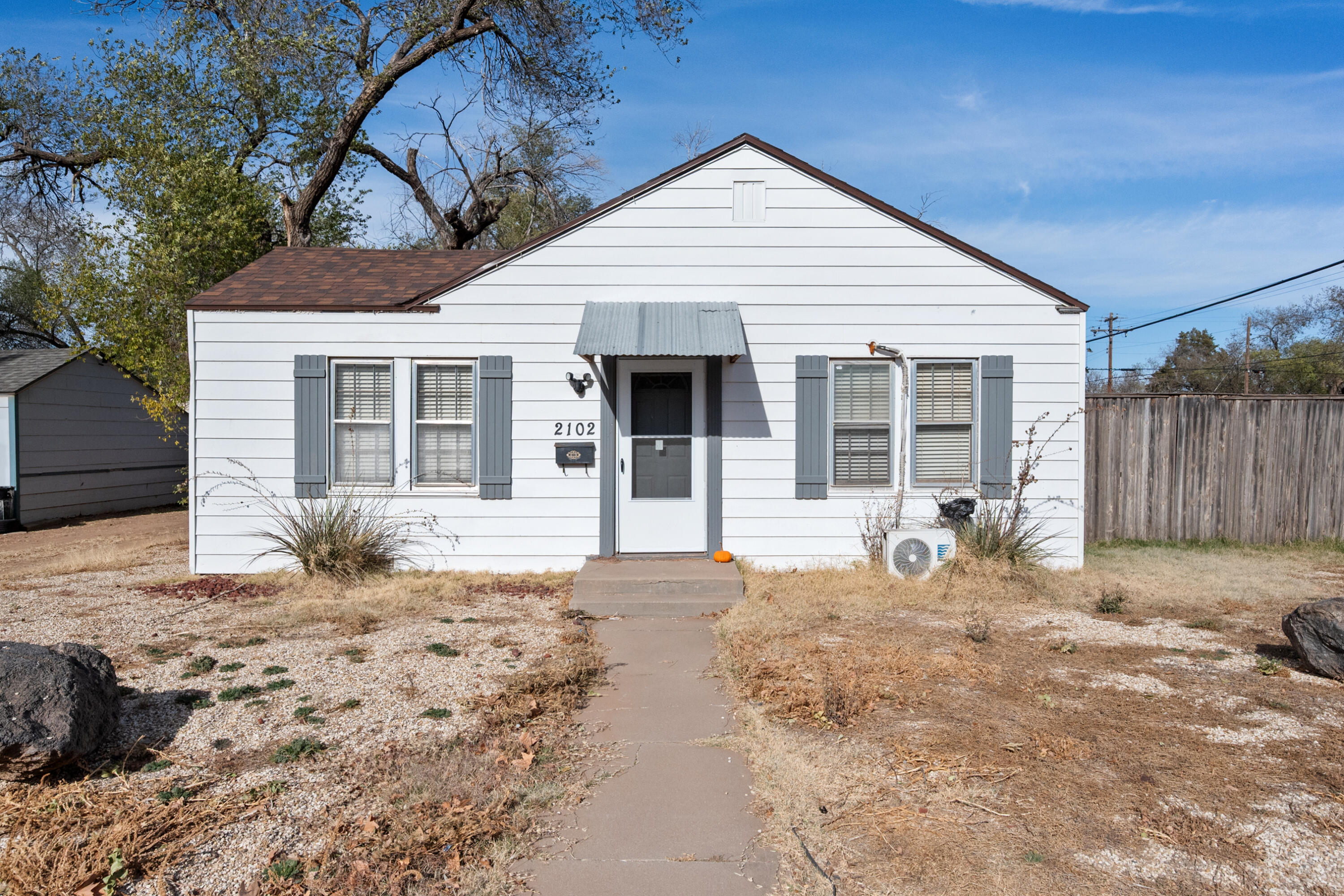 2102 25th Street Lubbock, TX 79411 - Photo 1 of 11 a front view of a house with a patio