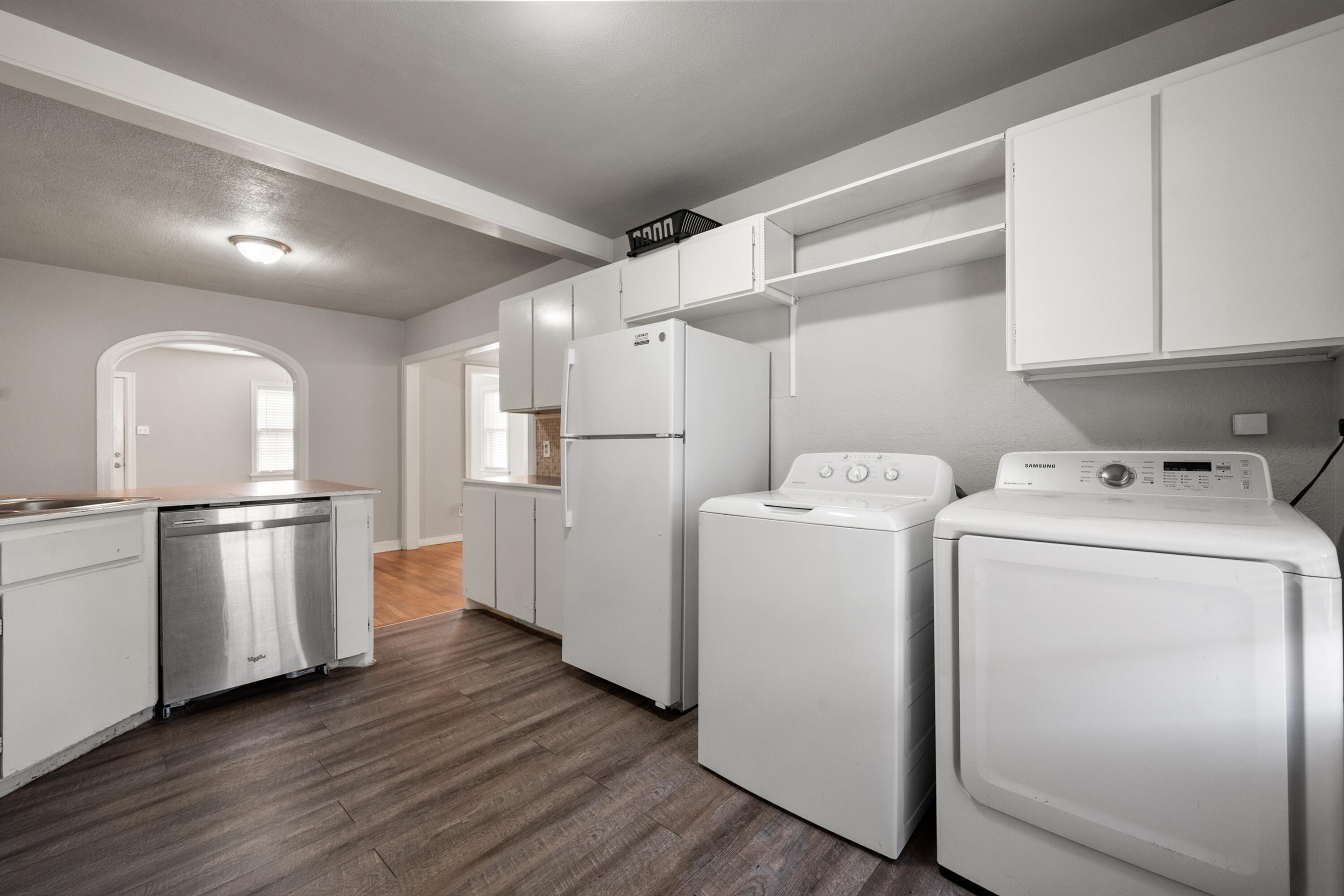 2102 25th Street Lubbock, TX 79411 - Photo 6 of 11 a view of storage and utility room with wooden floor
