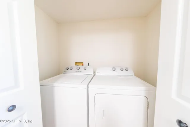 a utility room with dryer and washer