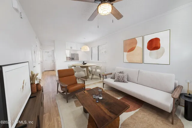 a living room with furniture and a flat screen tv