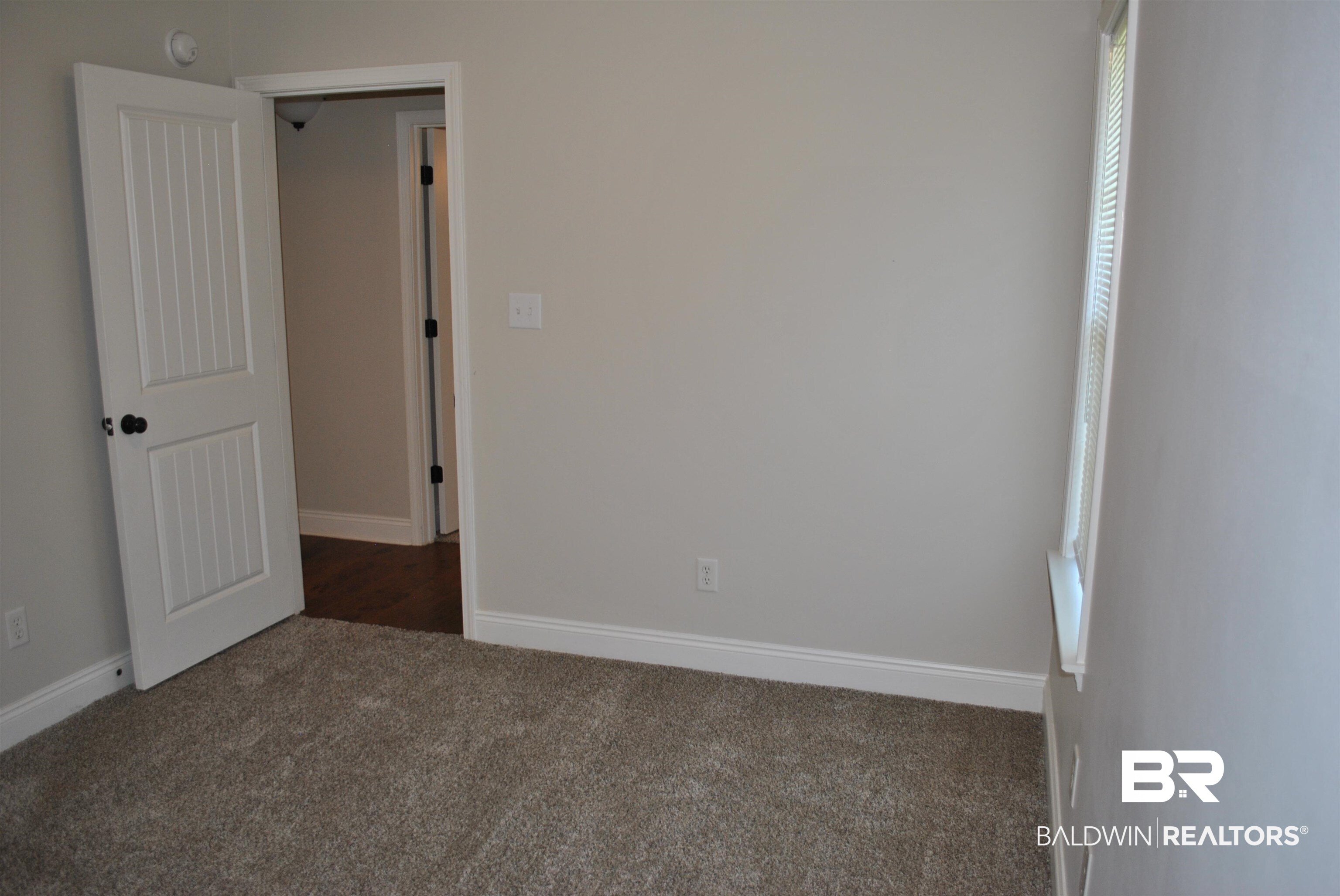 2161 Spring Grove West Mobile, AL 36695 - Photo 25 of 31 Empty room featuring dark colored carpet and baseboards