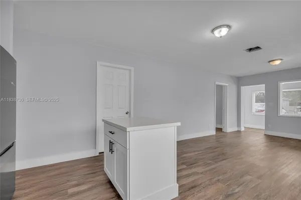 wooden floor with white walls